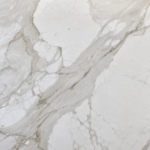 Calacatta Gold marble slab with white background, bold grey veining and golden accents