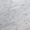 Luxury Calacatta Miele marble slab with white background and diagonal grey veining