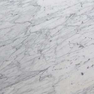 Luxury Calacatta Miele marble slab with white background and diagonal grey veining