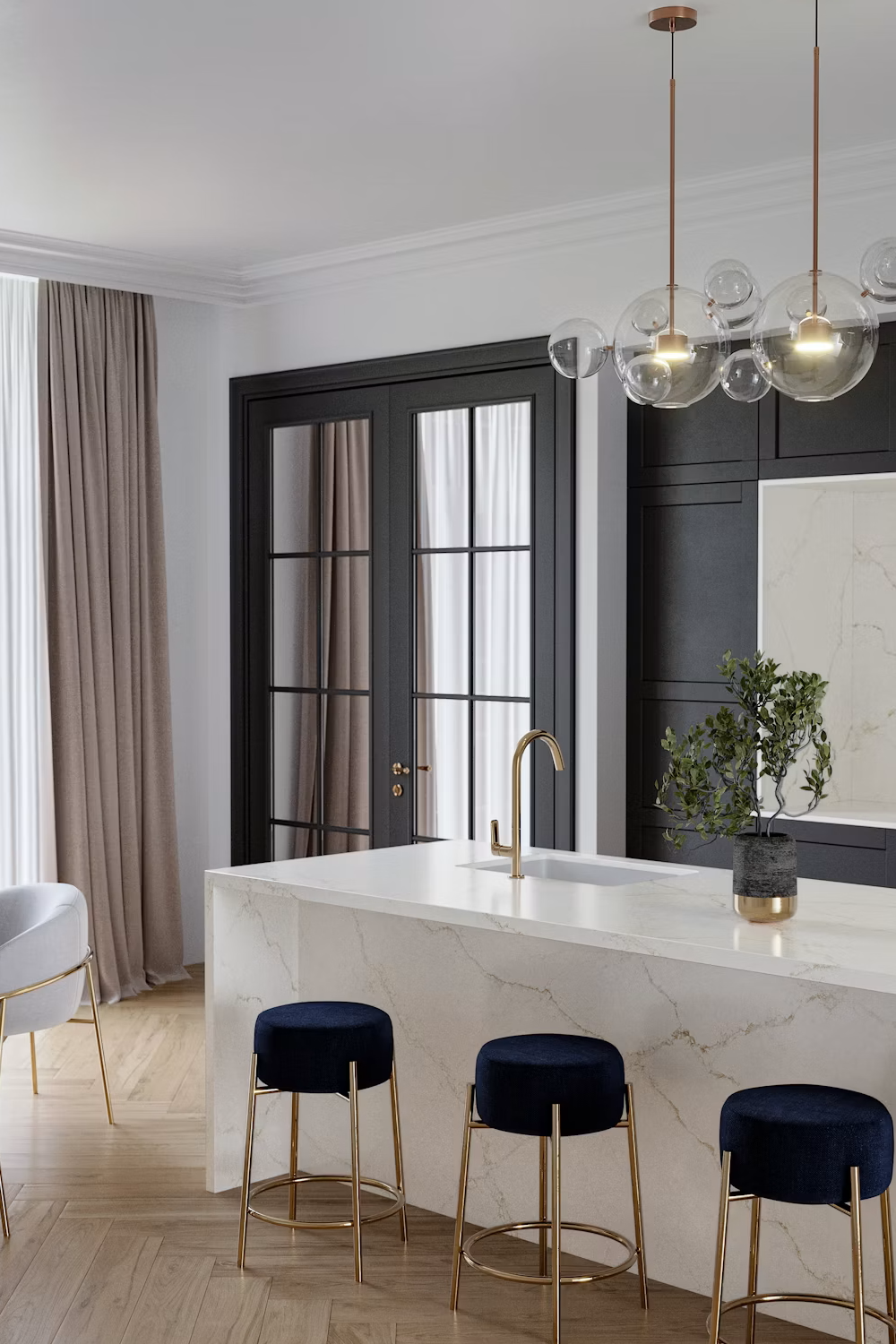 Le Blanc quartzite waterfall island with fine gold veining, navy stools and brass fixtures