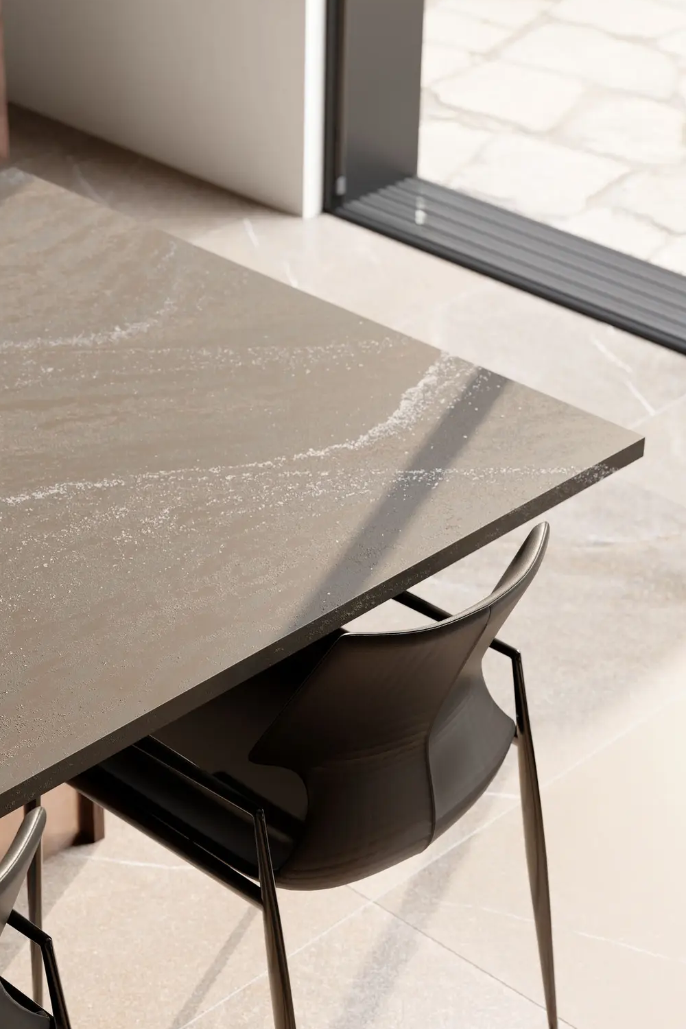 Remington Steel Cambria quartz table with taupe-grey mineral texture and leather dining chairs