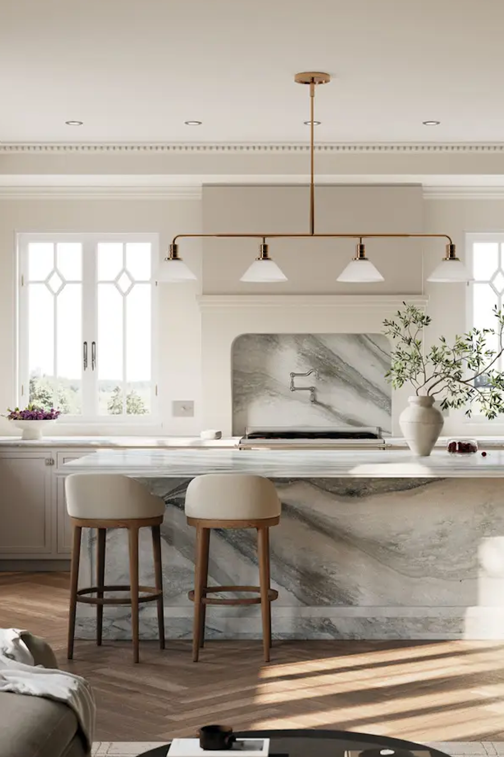 St Isley Cambria quartz island and arched range backsplash with grey-blue movement in a cream kitchen